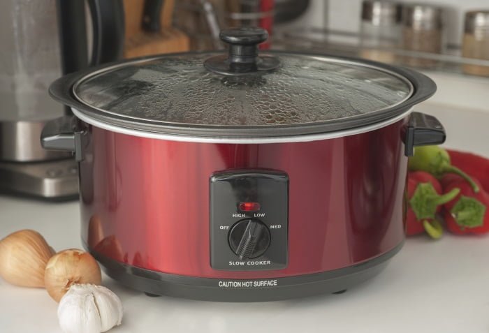 A red slow cooker