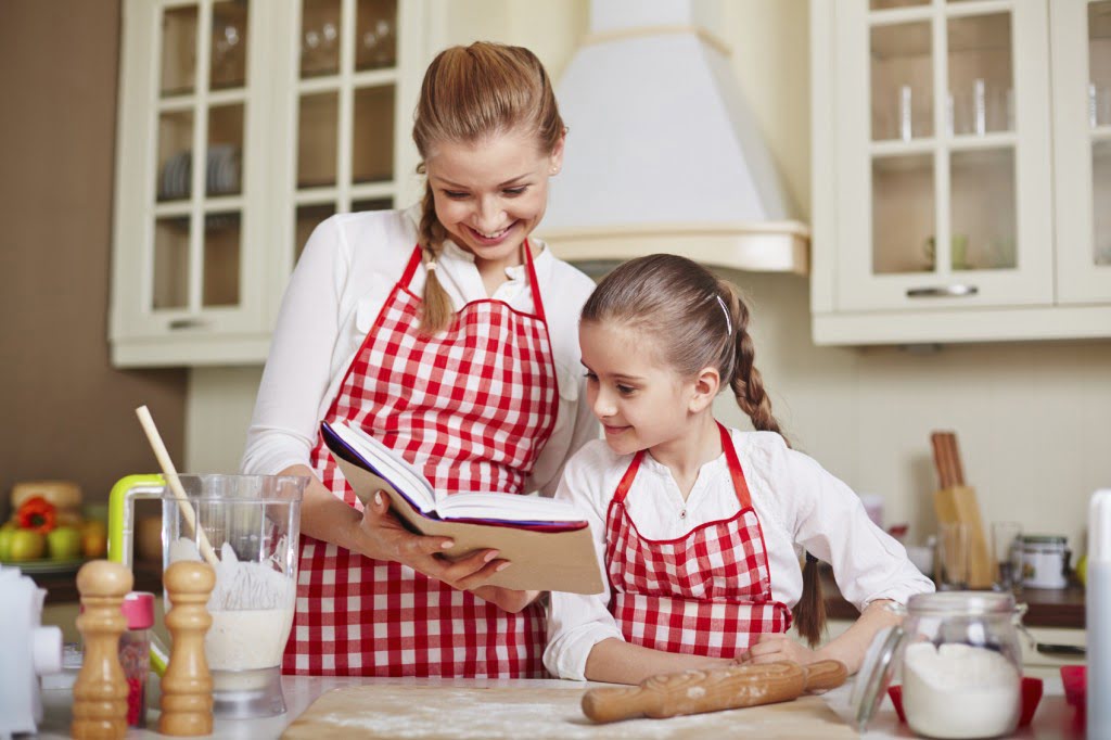 Mother and daughter choosing a recipe