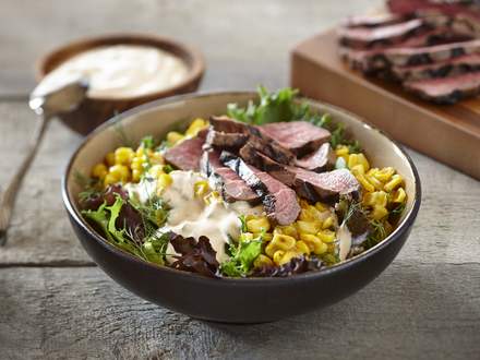 Mixed greens, corn and beef bowl